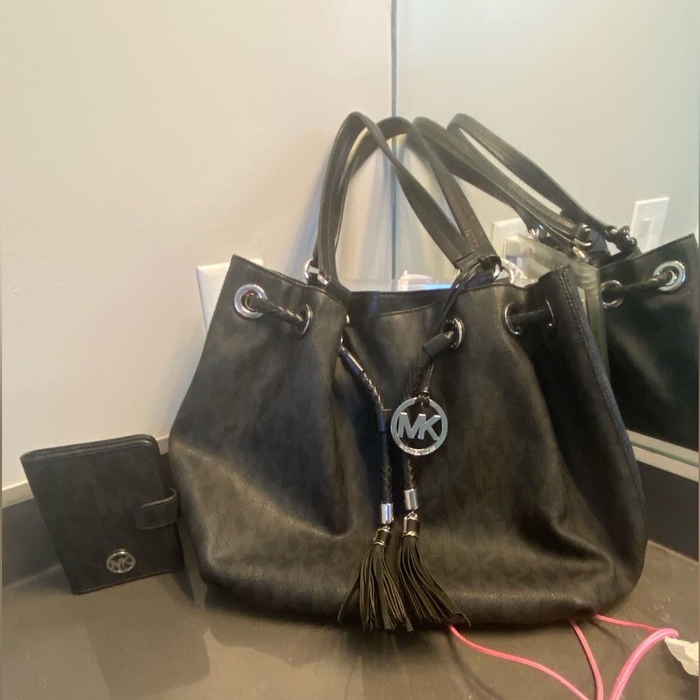 Authentic Michael Kors bag and matching wallet.
